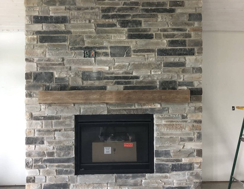 new build natural stone fireplace with oak hearth