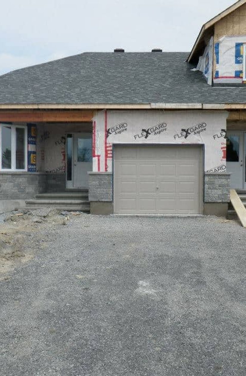 Stone veneer skirt and ceils wrapping around the font of the house