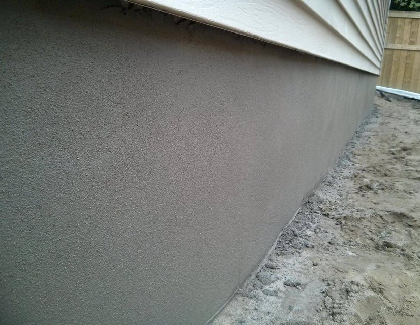 portland cement smeared on a block wall